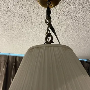 Overhead light haphazardly covered with electrical tape
