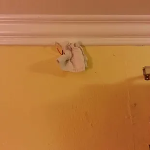 Hole in the wall, plugged with a towel!