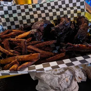 Way overcooked ribs and fries, tries to eat one rib and had to drink entire glass of soda to wash it down.