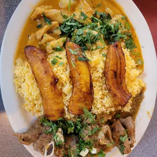 a plate of food with meat and rice