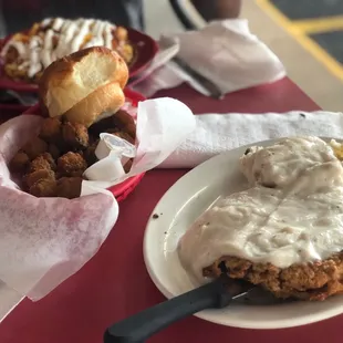 Chicken fried steak, mashed potato&apos;s, gravy, and fried okra.