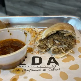 This is the beef salteña empanada. It was stuffed with meat filling.