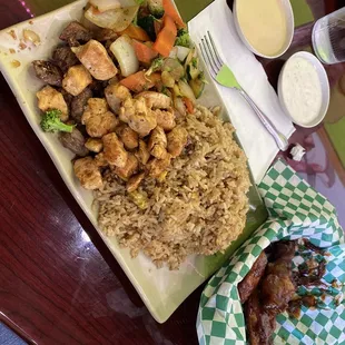 Chicken and steak hibachi with fried rice and honey bbq wings. (Lunch menu)