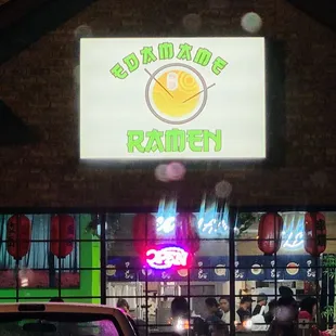 Storefront. At night.  While snowing.