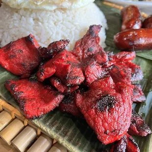 a plate of meat and rice