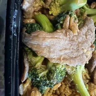 Beef was undercooked rice didn't taste good  Both dishes were bland.