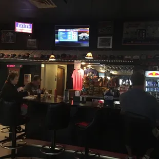 a man and a woman sitting at a bar