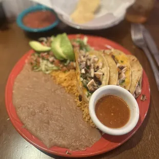 Grilled Taco Asados with chicken fajita meat. YUM YUM YUM. The rice and beans are *chefs kiss*