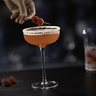 The 24 Karat Cocktail, featuring Belvedere vodka, Grand Marnier, Roederer Rosé and a gold sugar rim.