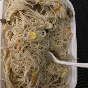 a bowl of noodles and mushrooms