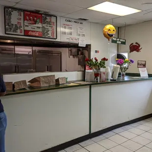 a woman standing at the counter