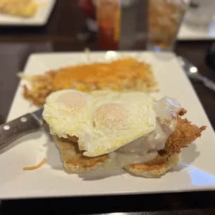 Chicken coup. Amazing fried chicken on top of delicious biscuit topped off with gravy!