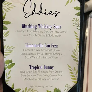 a hand holding a menu