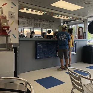 two people standing at the counter
