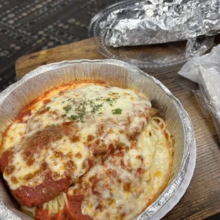 a pizza in a foil container