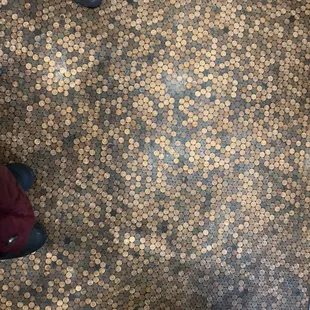 Elevator foot covered w pennies
