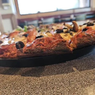 Crust burnt black to a crisp.  Asked fie knife to cur it off. Not edible...and I&apos;m  someone who likes pizza crust.