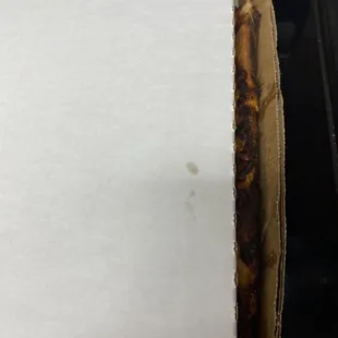 Pizza was sticking out of box.