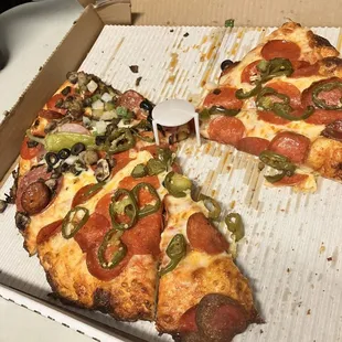 a slice of pepperoni and olive pizza