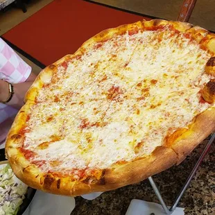 a large cheese pizza on a table