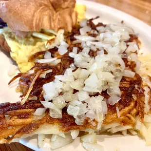 Bacon, egg &amp; pepper jack cheese sandwich on croissant w/shredded hash browns &amp; onion
