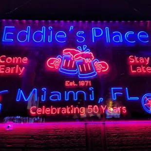 a neon sign for eddie&apos;s place