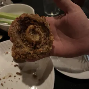 Fried mushroom in hand for size comparison. They are HUGE!!!