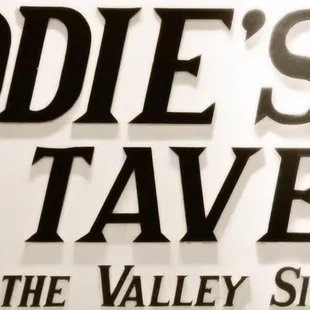 a sign for eddie&apos;s tavern