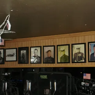 a row of framed military photos