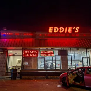 a car parked in front of a restaurant