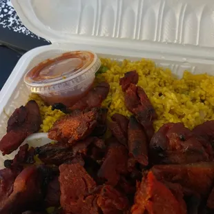 a styrofoam container of food
