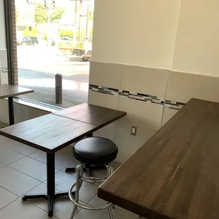 a table and stool in a restaurant
