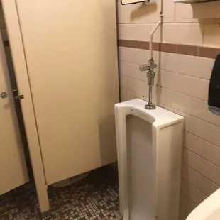 Rear view mirror in men's room