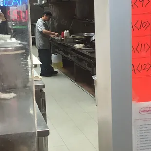 a man working in a restaurant kitchen