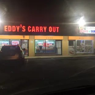 a car parked in front of the store