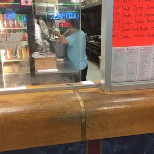 a man working behind a counter