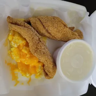 Catfish and grits with scrambled cheese eggs