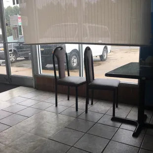 two chairs facing a window