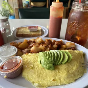 Ortega Chiles, Jack Cheese &amp; Sour Cream with avocado and country potatoes. Homemade hot sauce  is a must!