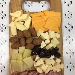 an assortment of cheeses and meats