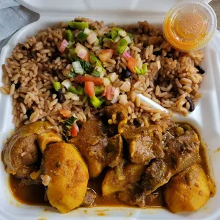 Curry goat w beans n rice side.