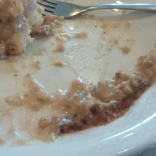 Burn marks on edges of gravy from 'nuking' (microwaving) YUK!  Biscuit was soggy &amp; this plate was NASTY.  Should've refused it!