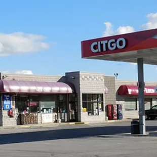 a gas station with a sky background