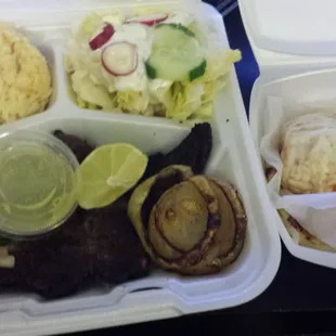 The carne asada with rice, salad, and pupusa with cabbage...Delicious and only 11$!