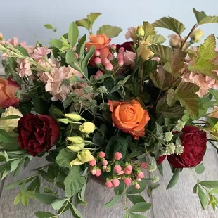 A luxurious floral arrangement in an ornate compote.