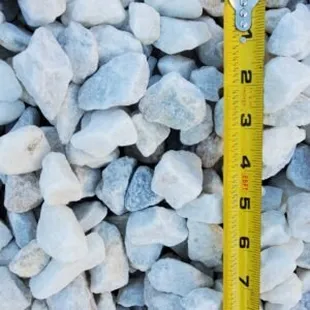 a measuring tape on a pile of rocks