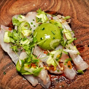 Rock fish crudo avocado jalapeño Agua chili sphere