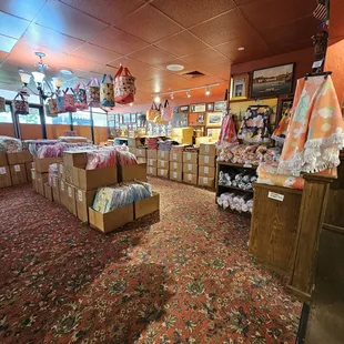 Hanging tote bags from the ceiling is a great use of space
