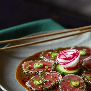 a plate of food with chopsticks
