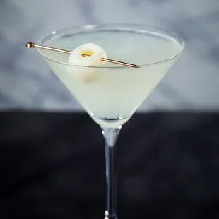 a martini glass filled with a martini